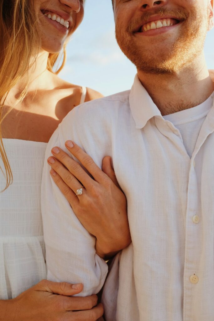 A man and a woman are smiling for the camera